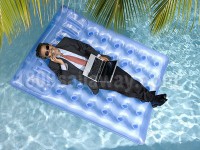 /album/fun-freedom-fulfilment/working-vacation-executive-with-laptop-and-cellphone-on-a-raft-jpg/